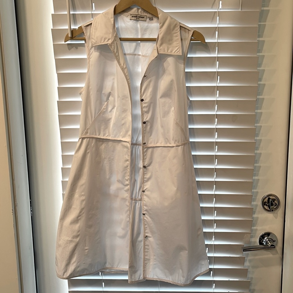 Opening Ceremony Size 4 white midi length sleeveless shirt.